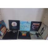 Eleven LP records including Queen, Elton John, Animals MFP, Fleetwood Mac and Genisis, four album