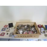 A collection of assorted world coinage and medallions and badges