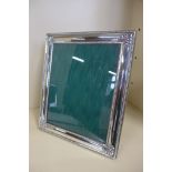 A large silver photo frame, 32x27cm - minor denting otherwise good