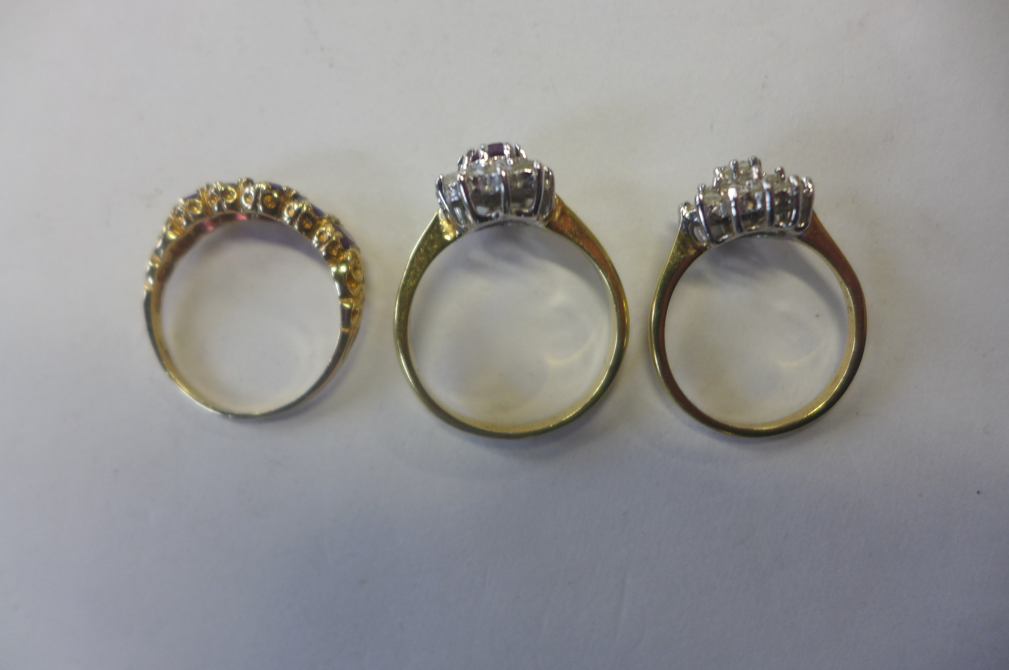 A hallmarked 9ct gold ring, approx 2.4 grams, and two unmarked gilt rings, approx 5.3 grams - Image 2 of 2