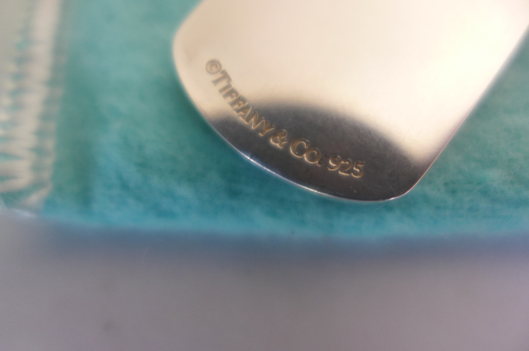 A Tiffany and Co silver dog tag on chain, with box and pouch, some minor scratches but reasonably - Image 3 of 3