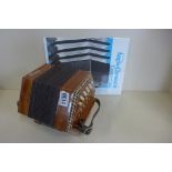 A Stagi Italian made English concertina with handbook