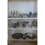 A good assortment of plated items, trays, tea sets and candle sticks