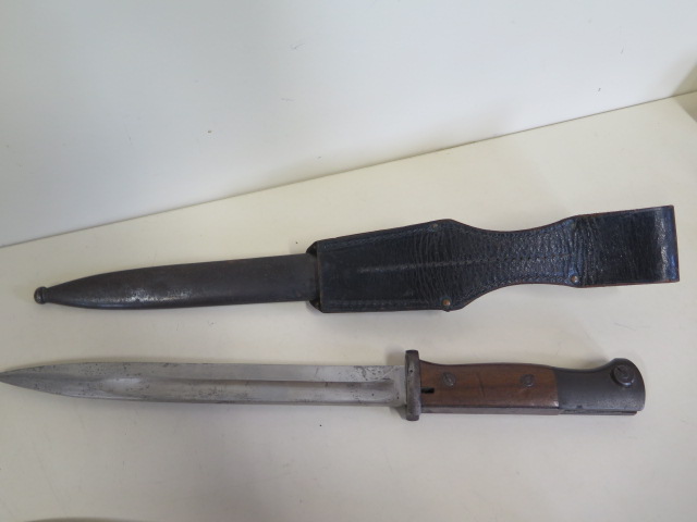 A German Rudolf Buchel bayonet and scabbard, engraved Ph Amend 1939, and another bayonet with wooden - Image 6 of 7