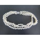 A double string of pearls with a silver clasp, 47cm long, generally good, some perfume residue