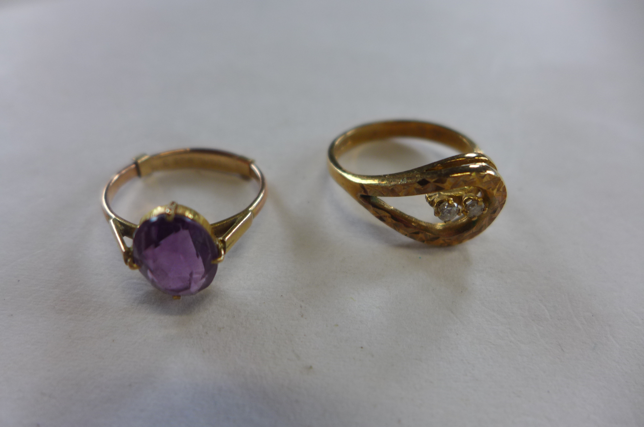 Two 9ct gold rings, sizes O, approx 5.5 grams, one set with two small diamonds, the other with an