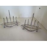 A pair of small navette shape silver toast racks, hallmarked London 1905 by William Hutton and