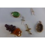 Two 9ct crosses and a T-bar, approx 1.6 grams, and an 18ct locket approx 3.3 grams, a pinchbeck