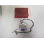 A silver cased compensation balance hunter pocket watch, 5.5cm wide on a plated chain, not working