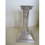 A single silver Corinthian column candlestick with filled base, hallmarked Sheffield 1891 - maker
