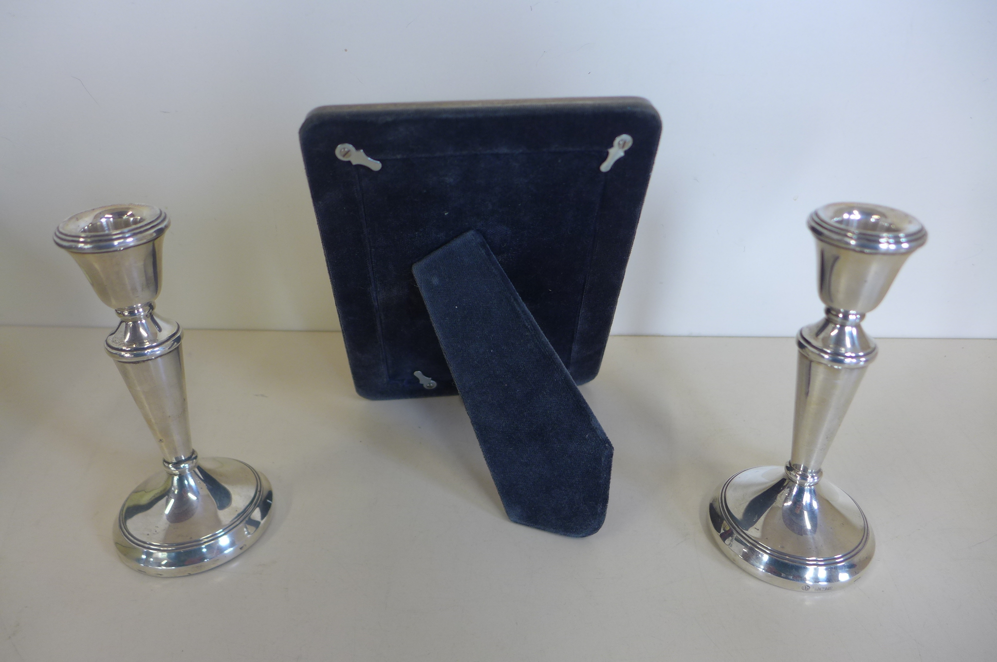 A pair of weighted silver candle sticks, 15cm tall, and a silver photo frame, 19x14cm, both - Image 5 of 5