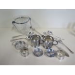 A collection of assorted plated items, including a glass ice bucket, cracked