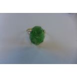 A 9ct ring, set with carved jade stone, marked 9ct, size L, approx 2.8 grams, generally good