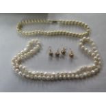 A string of pearls, 85cm long, a string of imitation pearls and two pairs of plated earrings