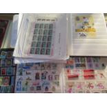 A large eclectic collection of World stamps including material on album pages, in stock books and in