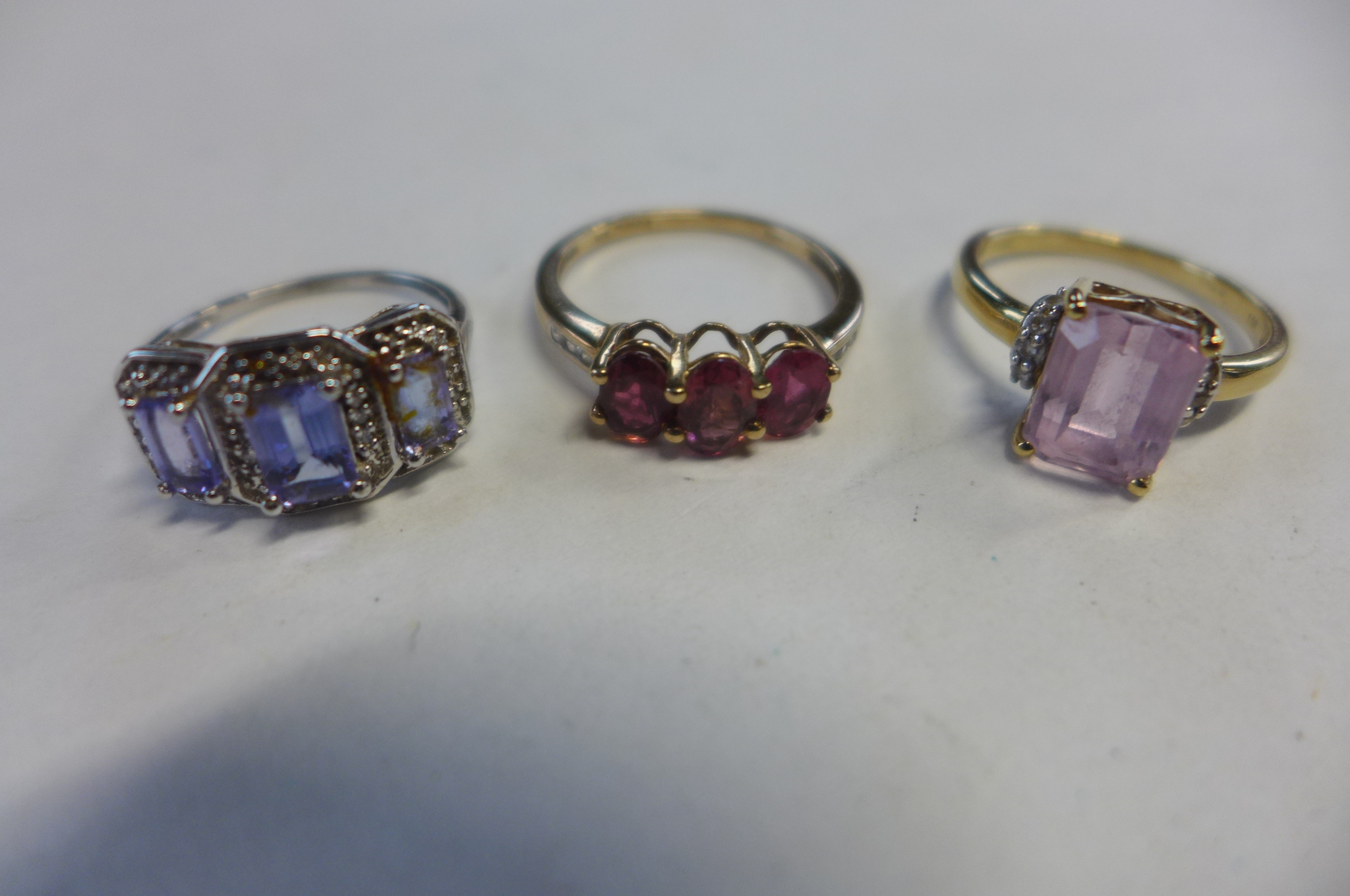 Three 9ct gold rings, sizes N and K, approx 7.3 grams, in good condition