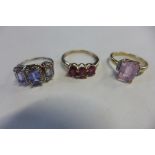 Three 9ct gold rings, sizes N and K, approx 7.3 grams, in good condition