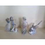 Three Lladro figures, girl with pump, 24cm tall, boy with wheel barrow, with foliate losses, and a
