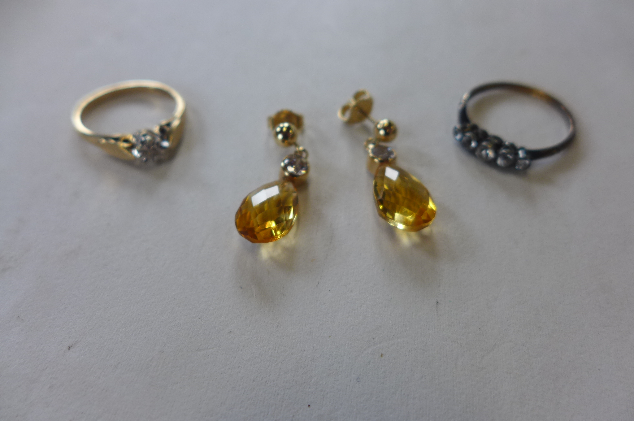 An 18ct ring, approx 1.5 grams, 9ct diamond ring, 2 grams, and a pair of 14ct earrings