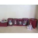 A collection of five boxed Villeroy and Boch Christmas figures and a church candle light, all good -