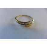 A hallmarked ring, set with diamonds, size R/S approx 1.3 grams, generally good