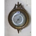 A gilt aneroid wall barometer, 38cm tall