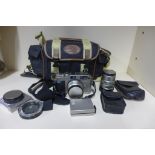 Contax GI with planer 2/35 lens, plus Contax 2.8/90 lens, and Contax TLA 140 flash assorted