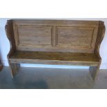 A rustic polished pine pew, 170cm wide