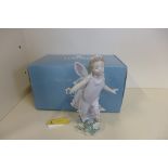 A Lladro figure 'Butterfly Wings' 06875 - boxed, minor petal losses