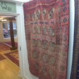 A hand knotted woollen Baluchi rug - 167cm x 116cm