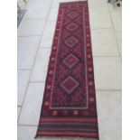 A hand knotted woollen Meshwani runner - 258x61 cm