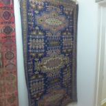 A hand knotted woollen Baluchi rug - 166cm x 96cm