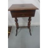 A mahogany work table on twin pillar supports, with two drawers, one with marquetry compartments,