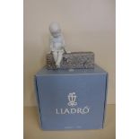 A Lladro figure 'Learning' 18281 - boxed in good condition - previous shop RRP 330euros