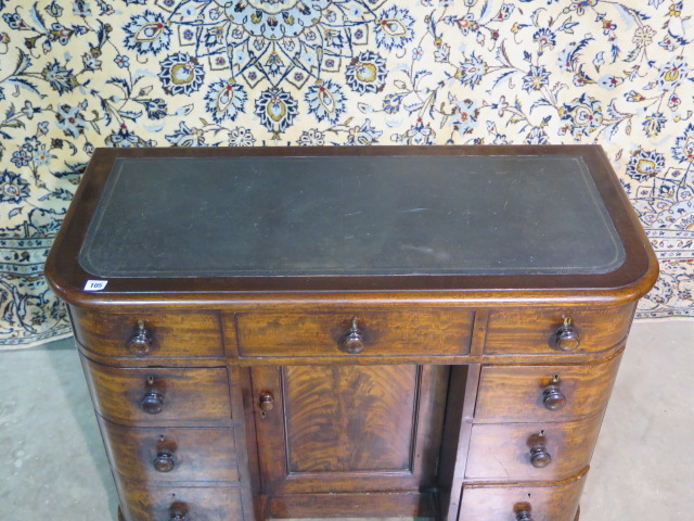 A 19th century mahogany bow fronted kneehole desk, with a lift up top above six drawers and a - Image 2 of 3