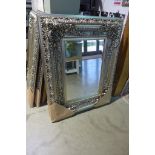 A modern ornate silvered mirror with beveled edged glass, 120cm 95cm