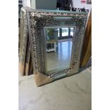A modern ornate silvered mirror with beveled edged glass, 120cm 95cm