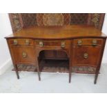 A 19th century mahogany serpentine fronts sideboard with three frieze drawers, a cellarette drawer