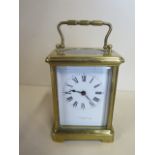 A French 8 day carriage clock, working, 12.5cm tall, small chips to front glass