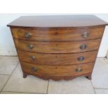 A Georgian mahogany bow fronted chest with four long graduating drawers on splayed bracket feet,