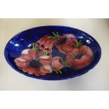 A Moorcroft oval Clematis blue, ground dish, 24cm long, generally good condition