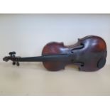 A late 17th/early 18th Century violin with a 13 7/8 back and grafted scroll bearing an old faded