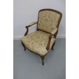An early 20th century Continental carved walnut chair on cabriolle legs