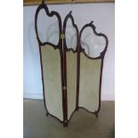 A 19th century Roco style mahogany framed three fold screen with glazed upper panes, the lower panes