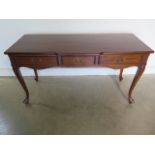 A 20th century reproduction side/centre table with three frieze drawers, 153cm W x 79cm H