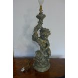 A 20th century cherub figure holding table lamp, 72cm H, tested and working