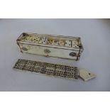 An early 19th century Napoleonic prisoner of war bone domino set, in original bone box, 11.5cm