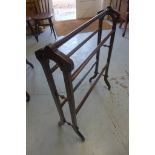 A late Victorian Gothic style mahogany towel rail, height 87cm, width 68cm - old repair to foot
