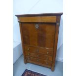 A 19th century walnut secretaire abattant with a drop front revealing a fitted interior of five