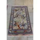 A wool and silk hand woven Shekargah Esfahan pictorial hunting scene rug with approx 900,000